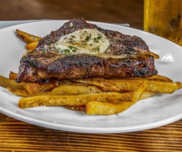 Steak Frites -  Grilled or Au Poivre / Maitre d' Butter / Hand-Cut Truffle Fries or Seasonal Vegetable