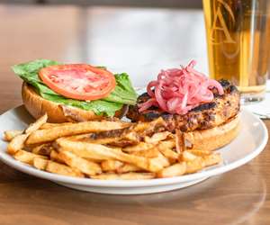 Housemade Salmon Burger / Pickled Red Onion / Tomato / Garlic Aioli / Toasted Brioche