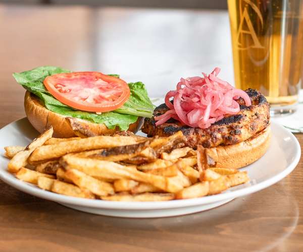 Housemade Salmon Burger / Pickled Red Onion / Tomato / Garlic Aioli / Toasted Brioche